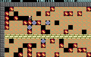 Boulder Dash（1996 DOS 复刻）：在砖墙、泥土、石块和宝石构成的格盘中逐格挖掘并收集宝石，规划通路并避开落石。